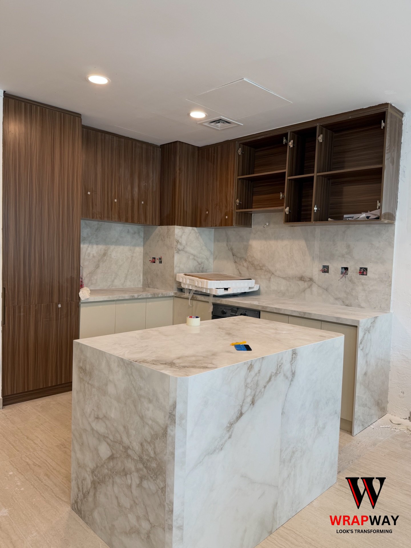 Vinyl wrap level: Expert 💯
Turned this space from basic to breathtaking.
Dark cabinets, marble magic, and endless vibes.
Swipe to see!